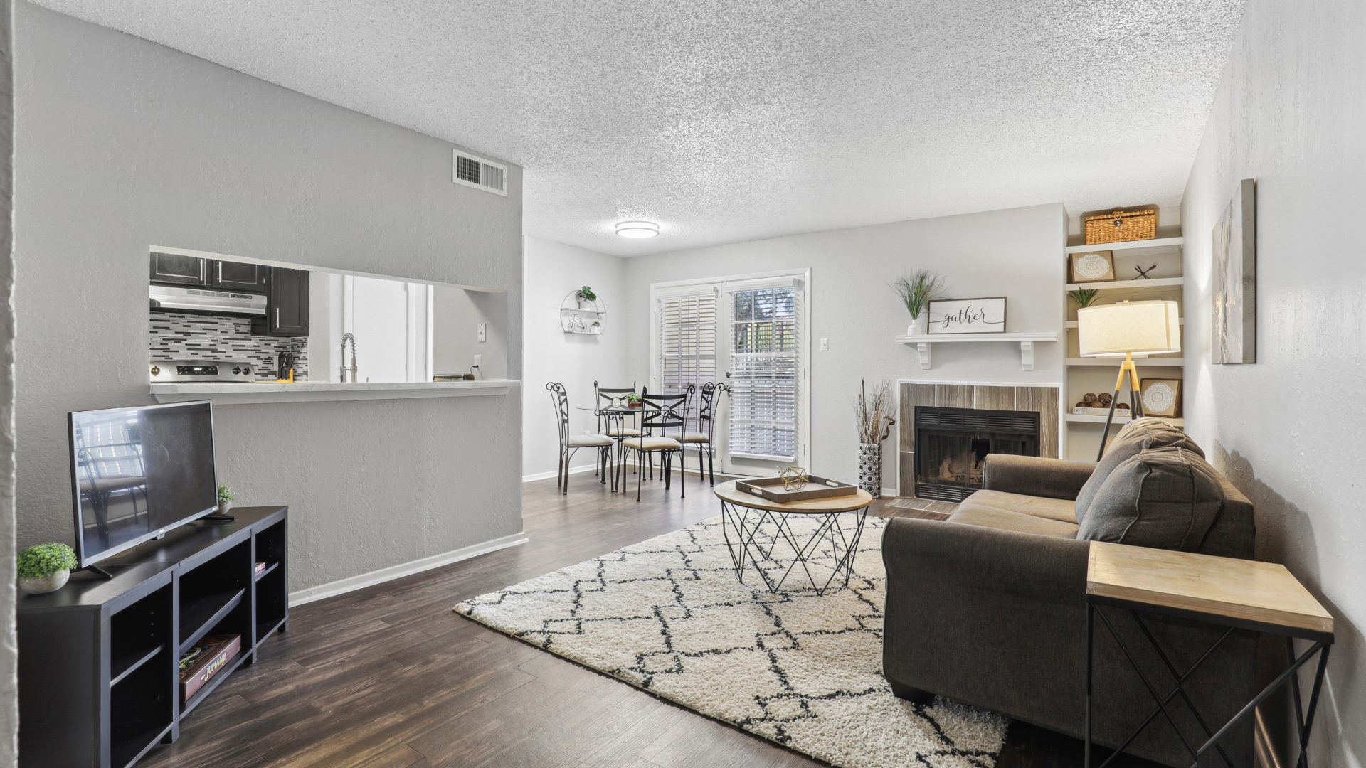 the living room and kitchen area of a apartment at The 3001 Crystal Springs